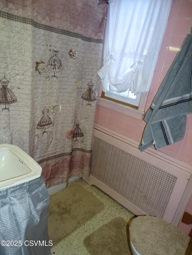 bathroom featuring radiator