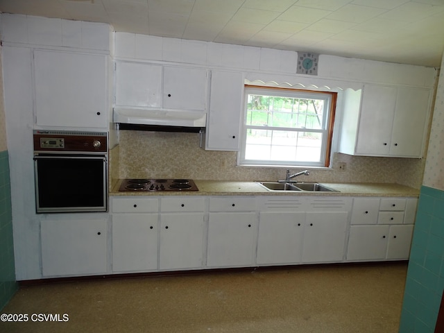 263 State Route 2026, Coal Township, PA 17866 - kitchen featuring black oven, a sink, electric stovetop, under cabinet range hood, and white cabinetry