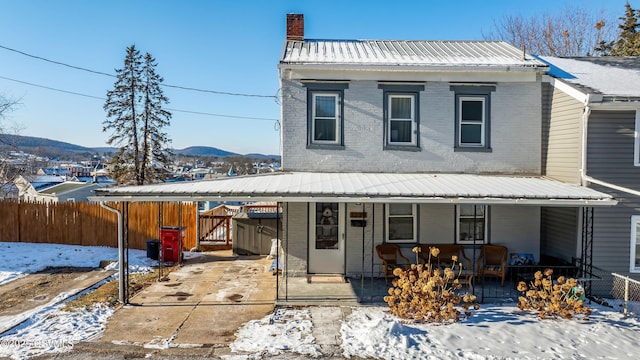 view of front of home featuring a porch and a mountain view