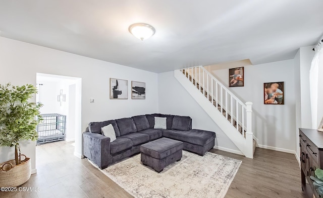 living room with light hardwood / wood-style flooring