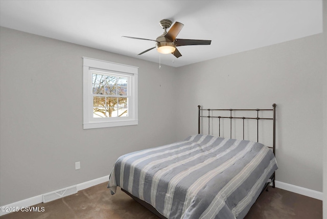 bedroom with dark carpet and ceiling fan