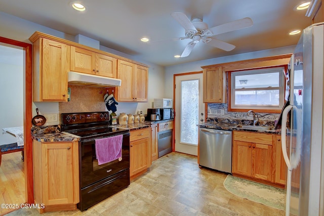 kitchen featuring sink, dishwasher, refrigerator, radiator heating unit, and black / electric stove