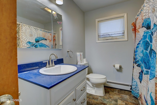 bathroom featuring vanity, toilet, and baseboard heating