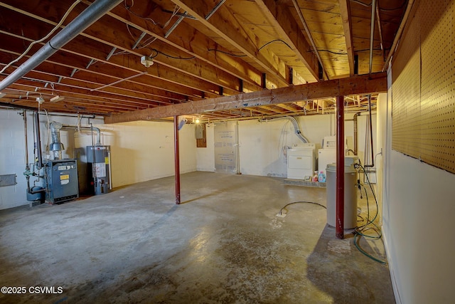 basement with washer and clothes dryer and gas water heater