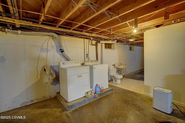 basement with washing machine and clothes dryer