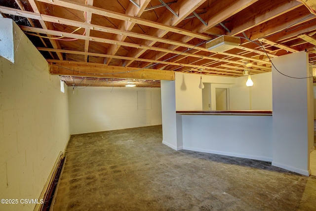 basement featuring baseboard heating