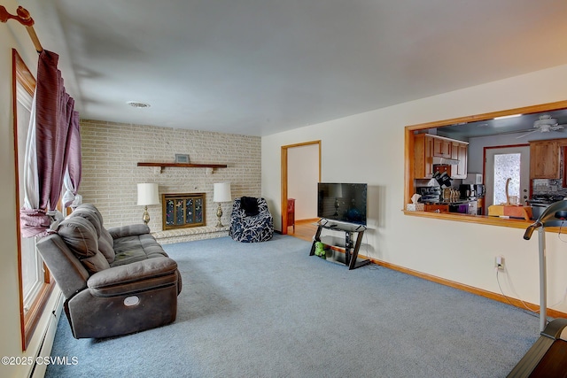 carpeted living room featuring ceiling fan, a baseboard radiator, and a fireplace