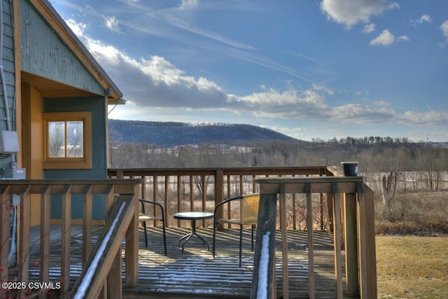 wooden terrace featuring a mountain view