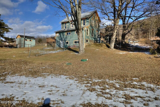 view of snow covered house