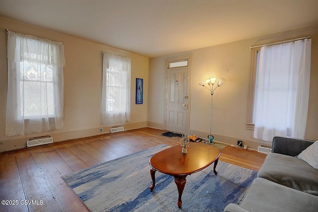 unfurnished living room with hardwood / wood-style floors