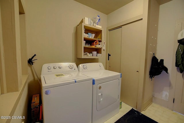 laundry room with washing machine and clothes dryer