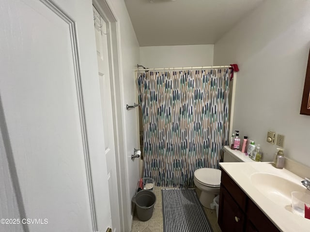 bathroom with vanity, toilet, and a shower with shower curtain