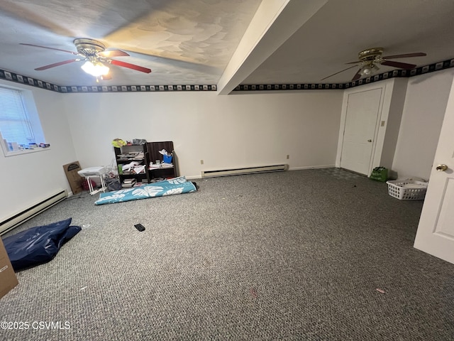 interior space featuring carpet floors, ceiling fan, and baseboard heating