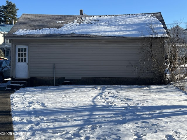 view of snow covered house