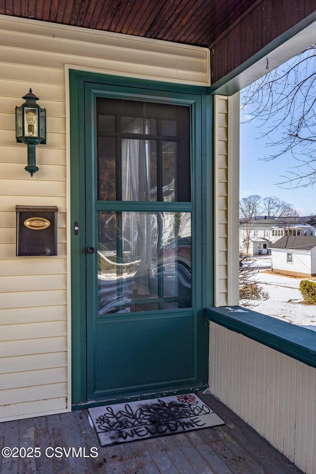 view of snow covered property entrance