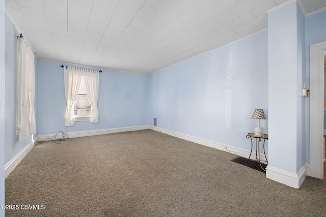 carpeted empty room featuring ornamental molding