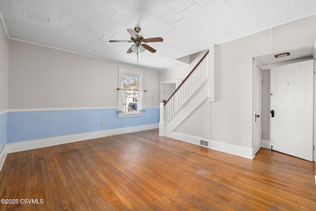 unfurnished living room featuring ornamental molding, hardwood / wood-style floors, and ceiling fan