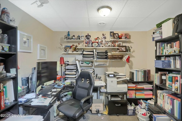 home office with a paneled ceiling