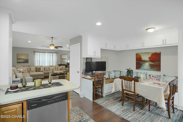 kitchen with white cabinetry, ceiling fan, dishwasher, and dark wood-type flooring