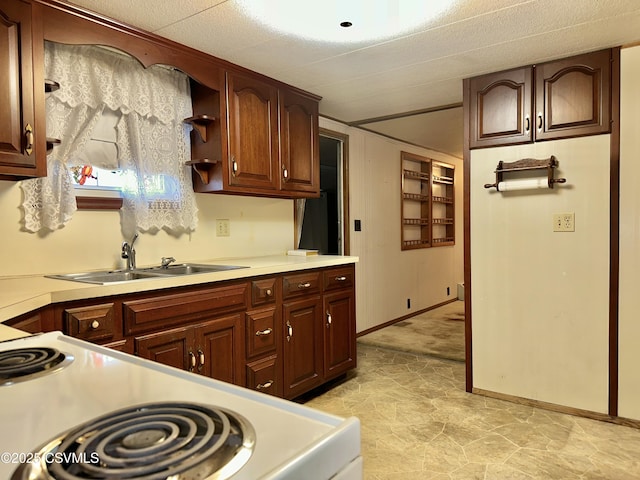 kitchen with sink and electric range oven