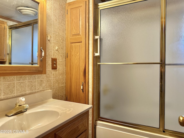 bathroom with enclosed tub / shower combo and vanity