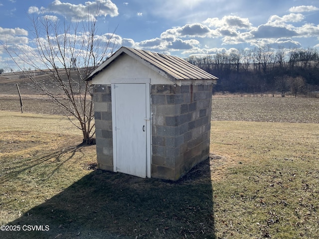 view of outbuilding featuring a rural view