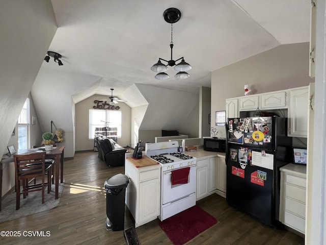 kitchen with dark wood-type flooring, white cabinets, lofted ceiling, and black appliances