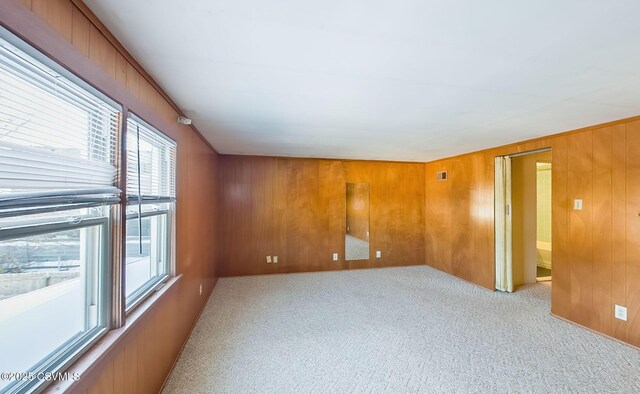 spare room with light colored carpet