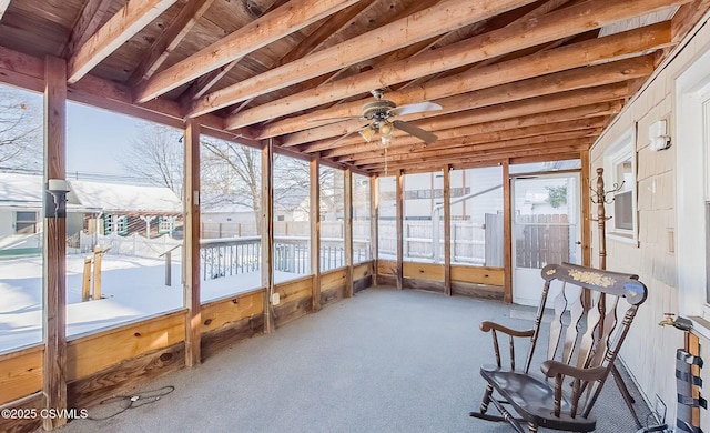 unfurnished sunroom with wood ceiling, ceiling fan, and lofted ceiling with beams