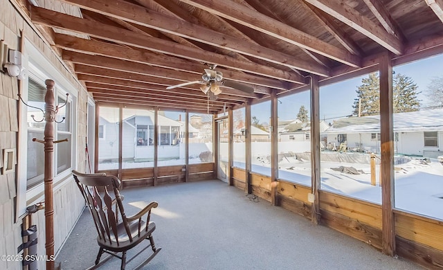 unfurnished sunroom with ceiling fan, lofted ceiling, and wooden ceiling