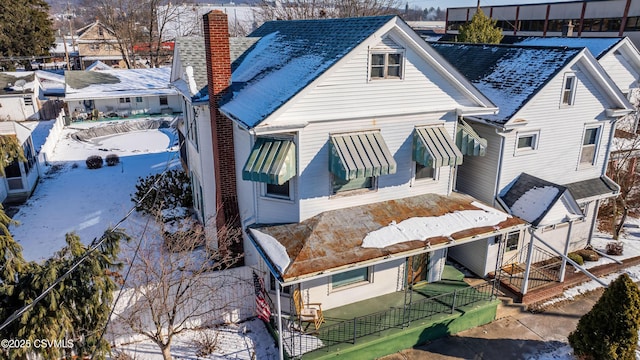 view of snow covered house