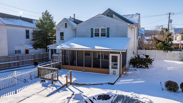 view of front facade with a sunroom