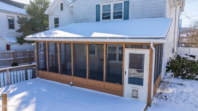 exterior space featuring a sunroom