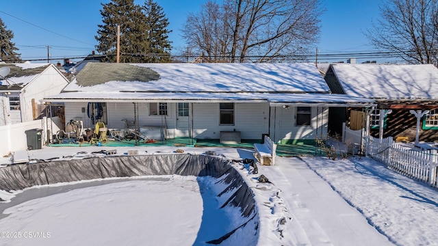 view of snow covered house