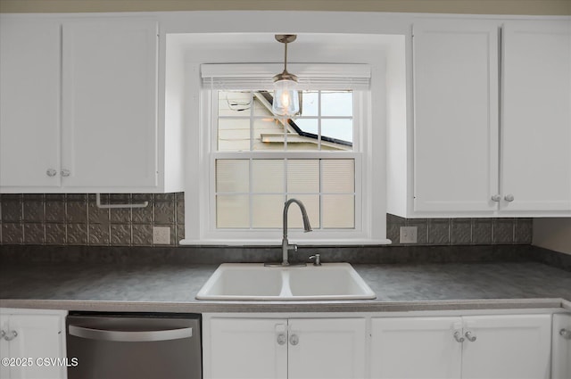 kitchen featuring sink, dishwasher, and white cabinets