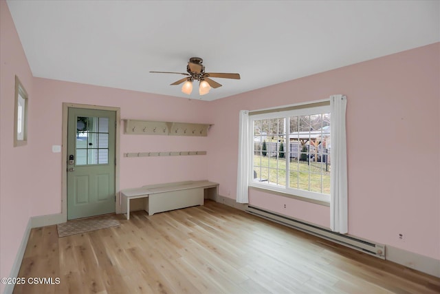 mudroom with a baseboard radiator, ceiling fan, and light wood-type flooring