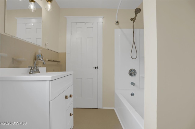 bathroom featuring vanity and washtub / shower combination