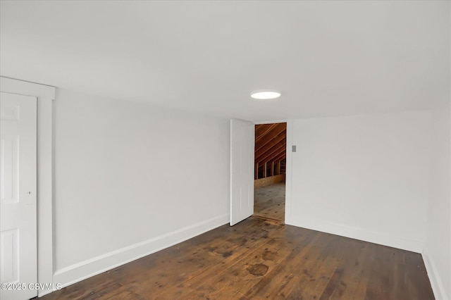 empty room featuring dark wood-type flooring