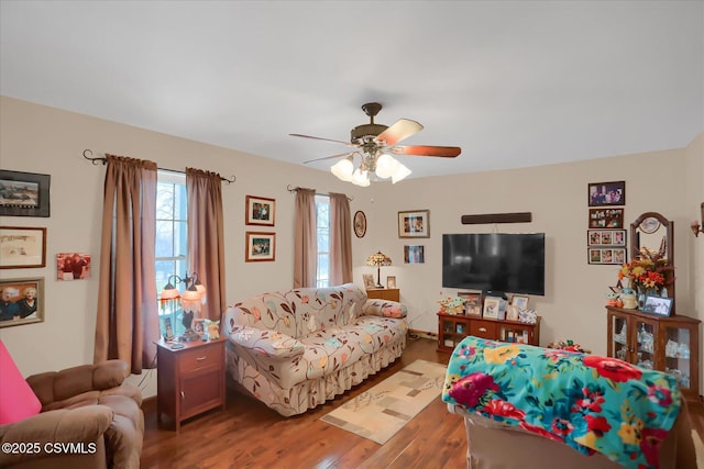 living room with hardwood / wood-style floors and ceiling fan