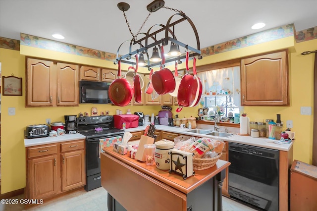 kitchen with a center island, sink, and black appliances