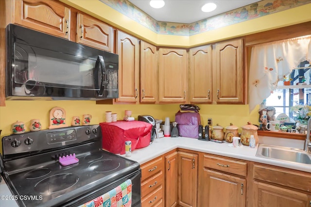 kitchen featuring sink and black appliances