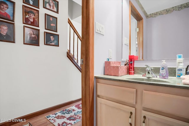 bathroom with vanity and hardwood / wood-style floors