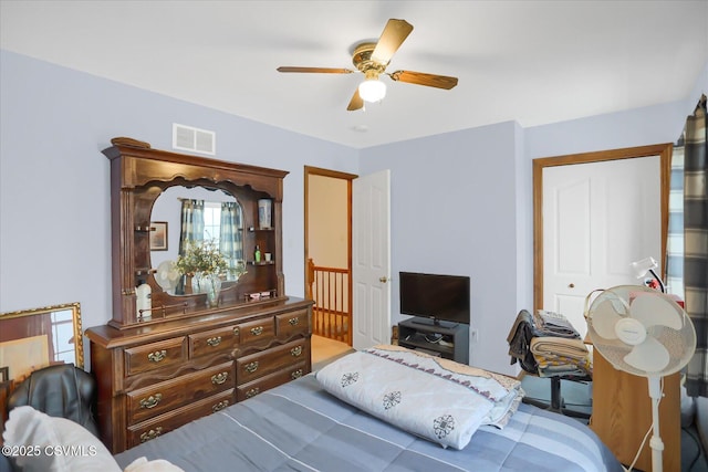 bedroom featuring ceiling fan and a closet