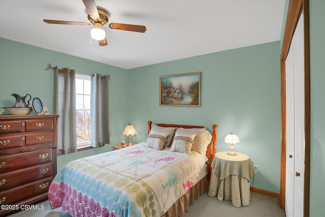 carpeted bedroom with a closet and ceiling fan