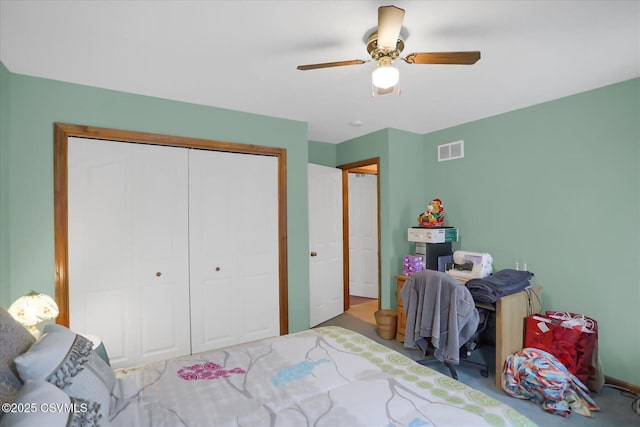 bedroom featuring ceiling fan and a closet