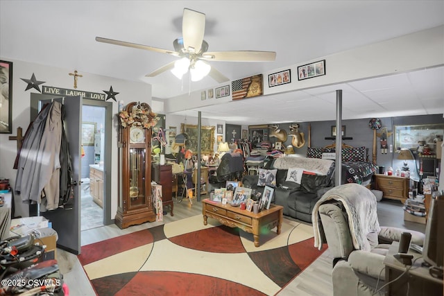 living room featuring ceiling fan and light wood-type flooring