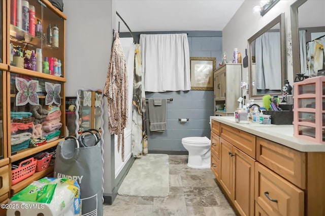 bathroom featuring vanity and toilet