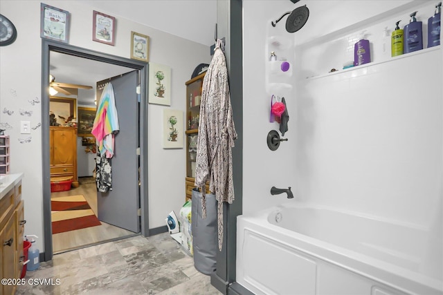 bathroom featuring vanity, bathing tub / shower combination, and ceiling fan