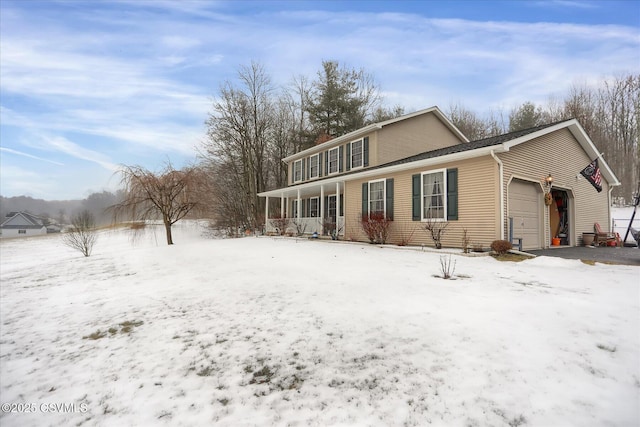 view of front of home with a garage and covered porch