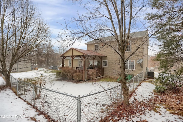 exterior space with a porch and central AC unit